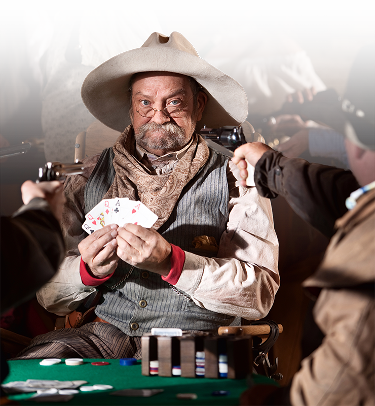 Coybow playing cards with guns against him